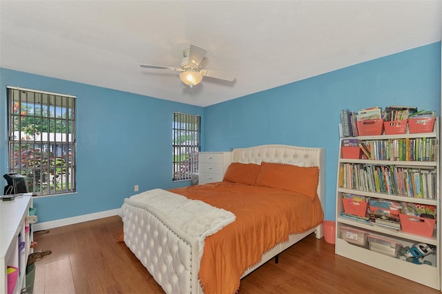 bedroom featuring dark hardwood / wood-style floors and ceiling fan