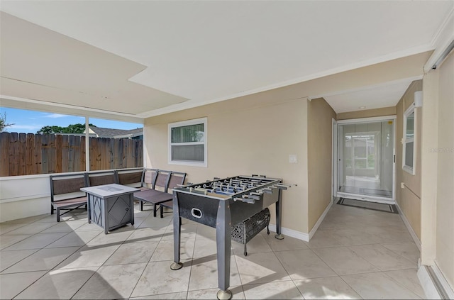 game room with light tile patterned floors