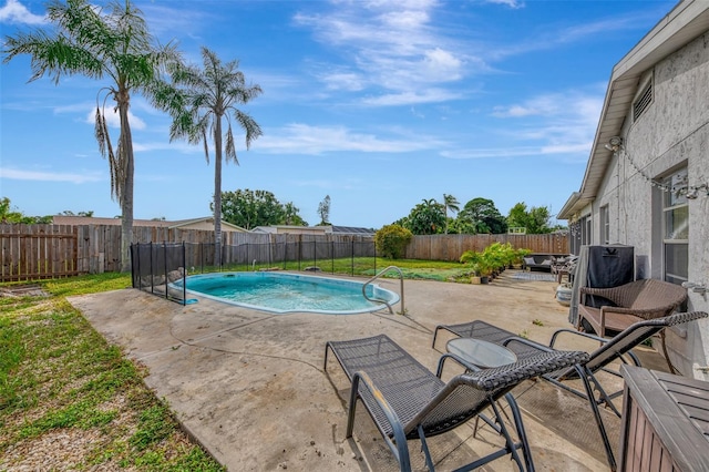 view of swimming pool with a patio