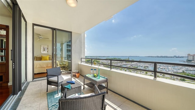 balcony featuring a water view