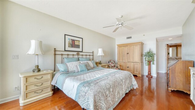 1255 N Gulfstream Ave Unit 1003, Sarasota, FL 34236 - bedroom featuring wood finished floors, baseboards, a ceiling fan, and a closet