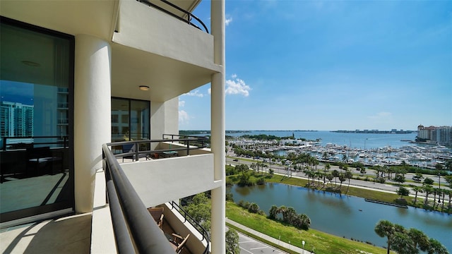 balcony featuring a water view