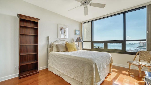 1255 N Gulfstream Ave Unit 1003, Sarasota, FL 34236 - bedroom featuring wood finished floors, baseboards, and a ceiling fan