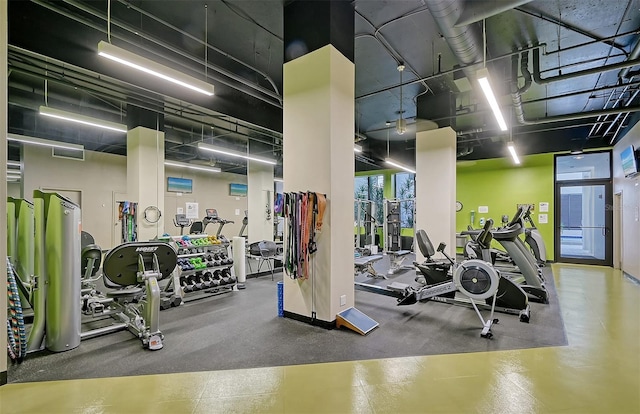 workout area with a towering ceiling