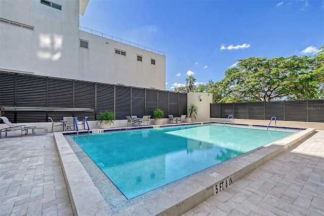 view of swimming pool featuring a patio