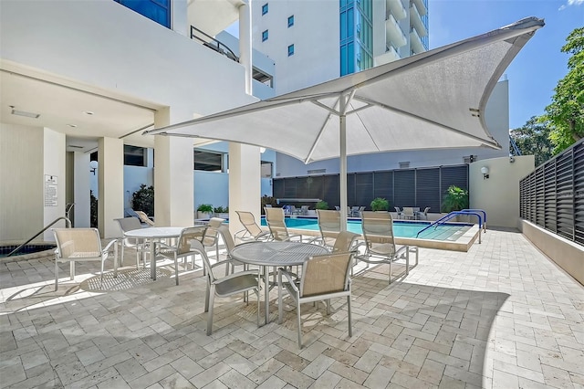 1255 N Gulfstream Ave Unit 1003, Sarasota, FL 34236 - view of patio / terrace with a community pool
