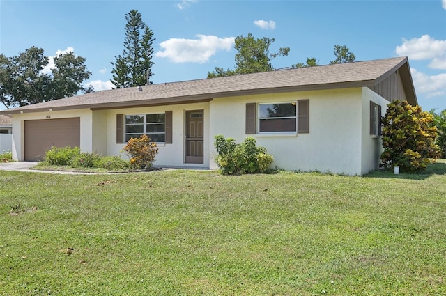 ranch-style house with a garage and a front lawn