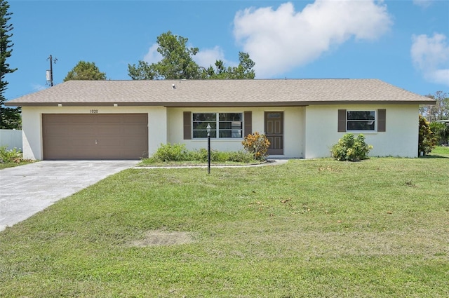 ranch-style home with a garage and a front yard