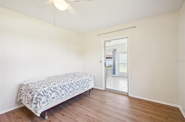 bedroom featuring ceiling fan and hardwood / wood-style flooring