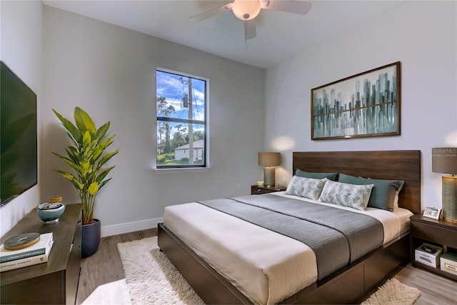 bedroom featuring light hardwood / wood-style floors and ceiling fan