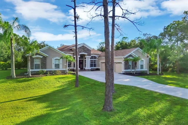 ranch-style house featuring a front yard and a garage