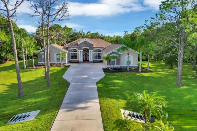 view of front of property with a front lawn