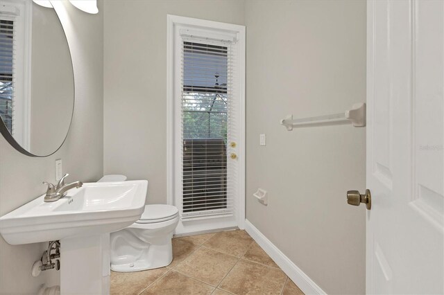 bathroom with tile patterned floors and toilet