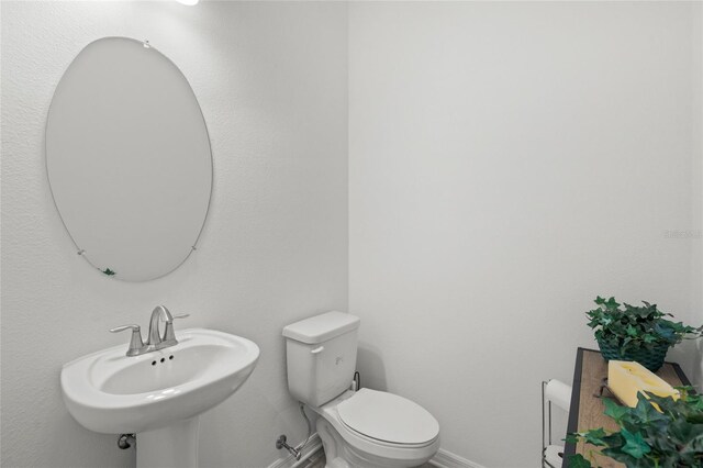 bathroom with sink and toilet