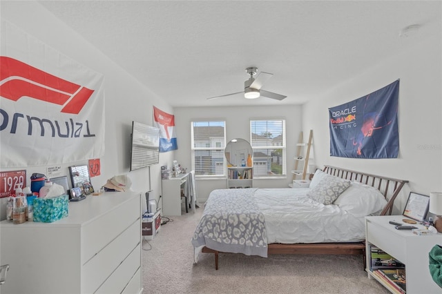 bedroom with ceiling fan and carpet floors