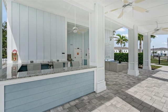 view of patio / terrace featuring ceiling fan