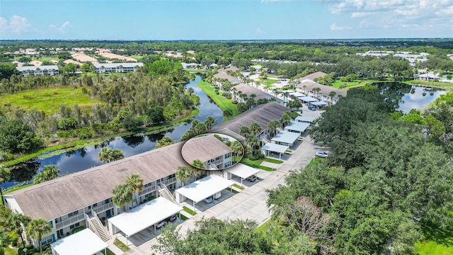 birds eye view of property with a water view