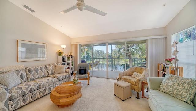 living room featuring ceiling fan, light carpet, and high vaulted ceiling