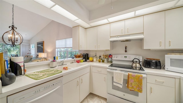 kitchen featuring sink, light tile patterned floors, white appliances, decorative light fixtures, and an inviting chandelier