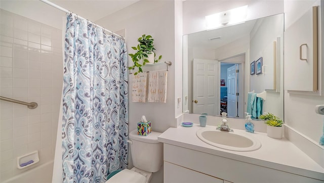 full bathroom featuring vanity, toilet, and shower / bath combination with curtain