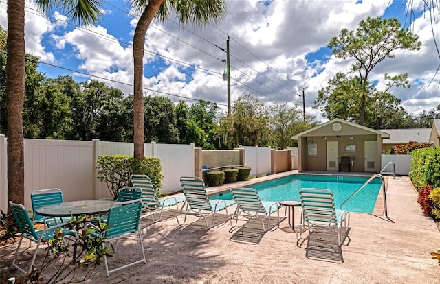 view of swimming pool featuring a patio