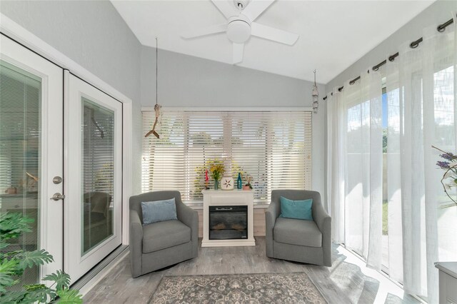 sunroom / solarium with lofted ceiling and ceiling fan