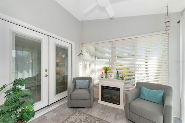 living area featuring french doors, ceiling fan, plenty of natural light, and hardwood / wood-style floors