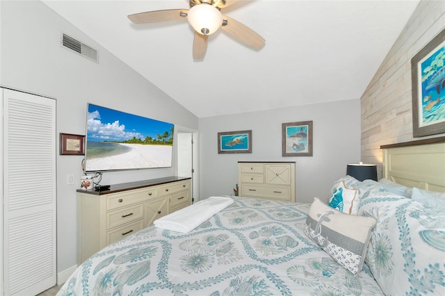 bedroom with ceiling fan, a closet, and vaulted ceiling