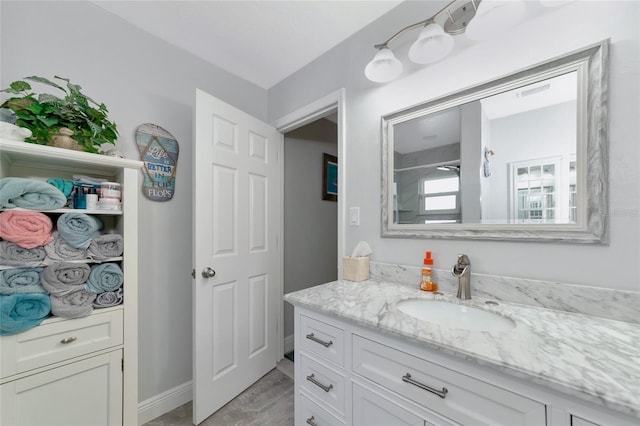 bathroom featuring wood-type flooring and vanity