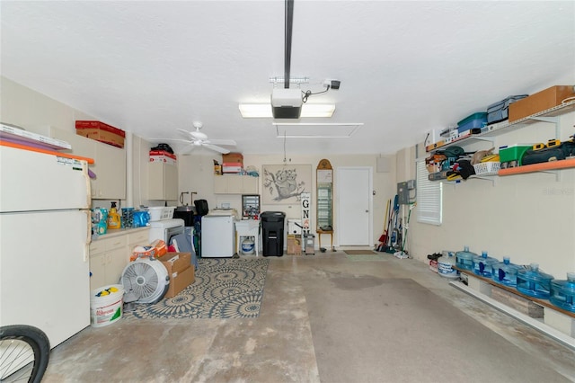 garage featuring washer / clothes dryer, ceiling fan, and white refrigerator