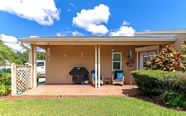 back of house with a patio