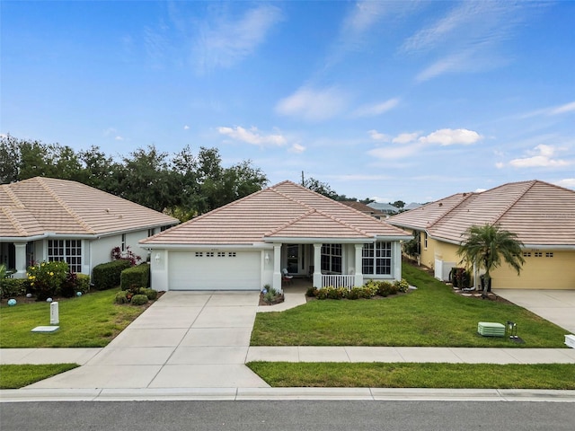 single story home with a garage and a front lawn