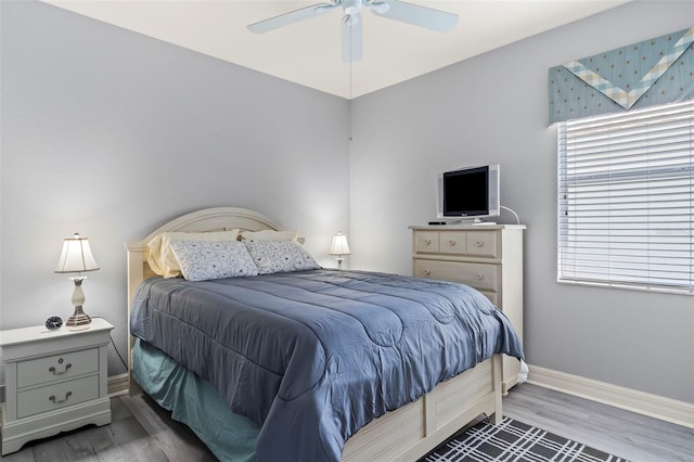 bedroom featuring ceiling fan and hardwood / wood-style flooring