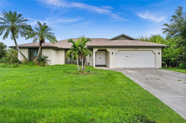 ranch-style house with a front yard and a garage