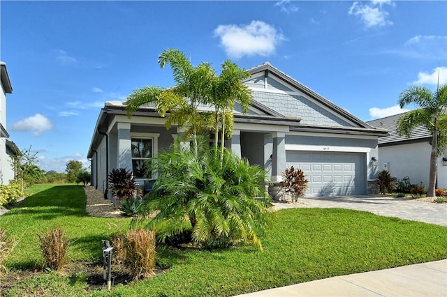 view of front facade featuring a garage and a front lawn