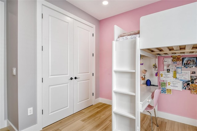 bedroom with light wood-type flooring