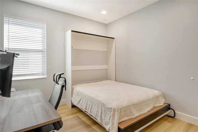 bedroom with light hardwood / wood-style flooring