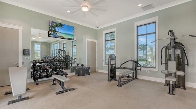 gym with ceiling fan, ornamental molding, and a healthy amount of sunlight