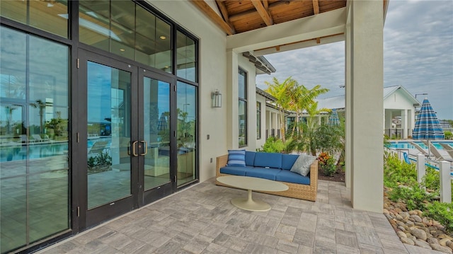 exterior space with french doors and an outdoor living space