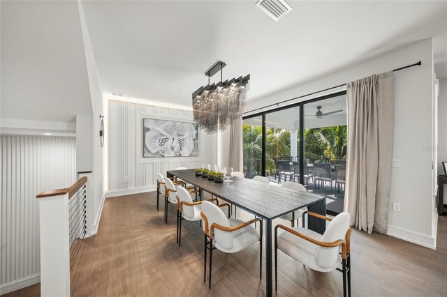 dining area with hardwood / wood-style floors and ceiling fan