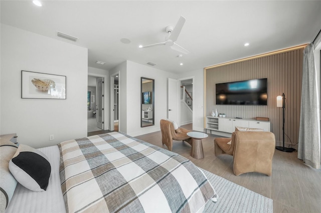 bedroom featuring ceiling fan and light hardwood / wood-style flooring