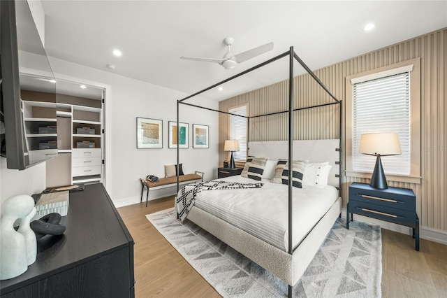 bedroom with ceiling fan and wood-type flooring