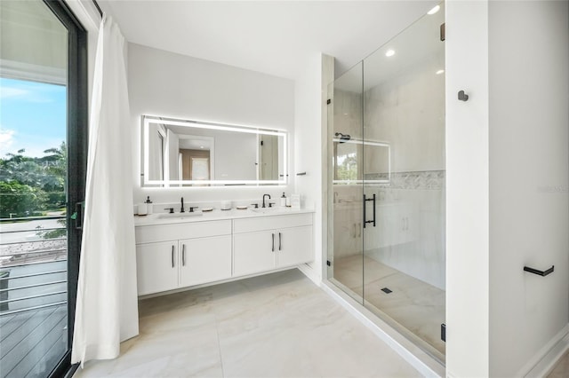 bathroom with vanity and an enclosed shower