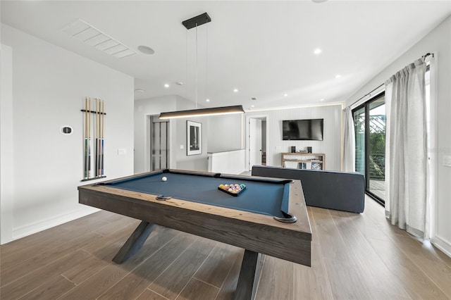 recreation room with hardwood / wood-style flooring and pool table