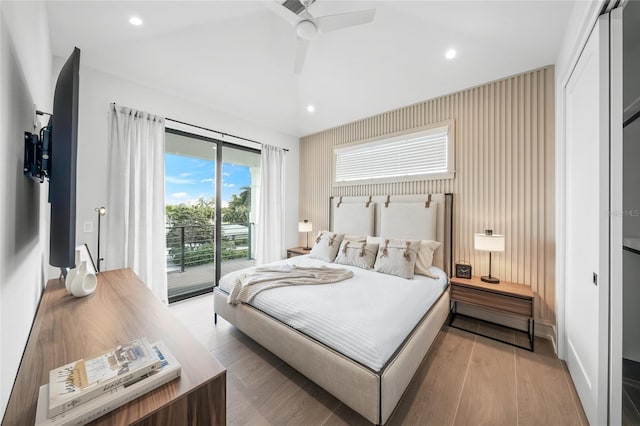 bedroom featuring access to exterior, light hardwood / wood-style floors, and ceiling fan