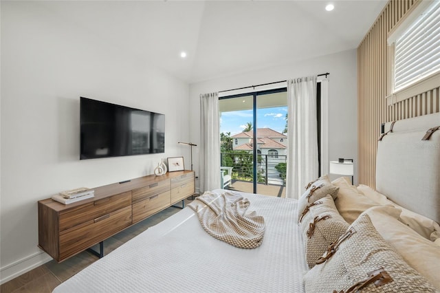 bedroom with access to outside and dark hardwood / wood-style floors