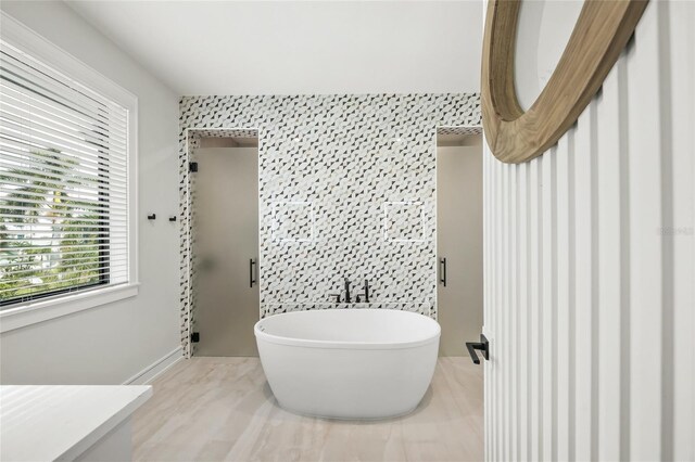 bathroom featuring tile walls and plus walk in shower