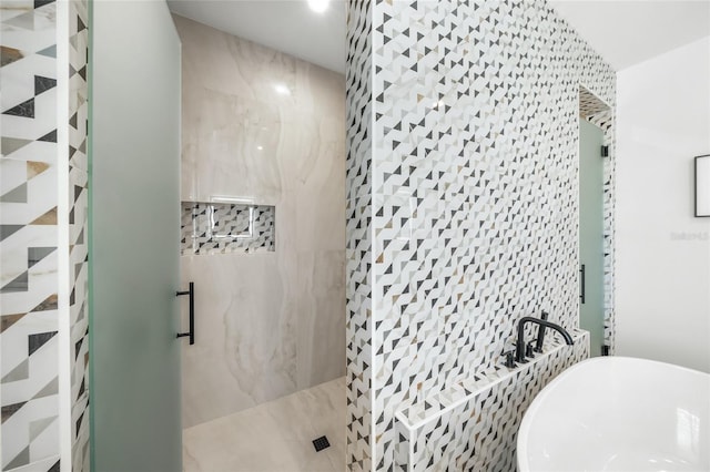 bathroom with separate shower and tub and tile walls