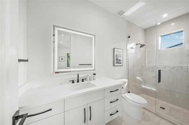 bathroom featuring walk in shower, vanity, and toilet