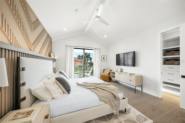 bedroom with ceiling fan, lofted ceiling with beams, and hardwood / wood-style flooring